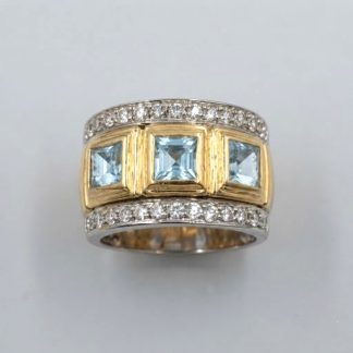 Anillo de oro 18k con topacios azules
